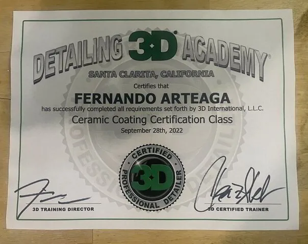 Armando King Mobile Detailing displays a dealer certificate beside its mobile car detailing setup.