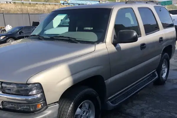 A silver truck in the parking lot gets mobile car detailing from Armando King Mobile Detailing.