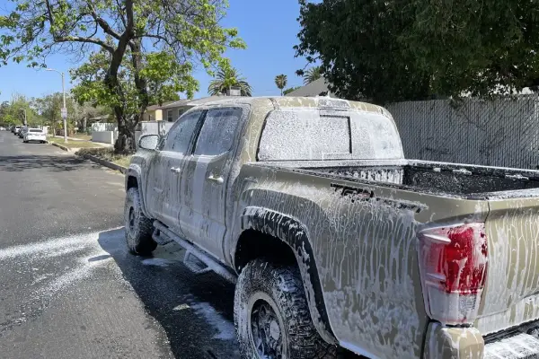 An ice covered truck on the street is restored by Armando King Mobile Detailing through mobile auto detailing San Fernando Valley.
