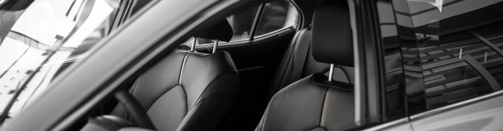 Inside black leather seats, Armando King Mobile Detailing performs full auto detailing at home in Canoga Park, CA.