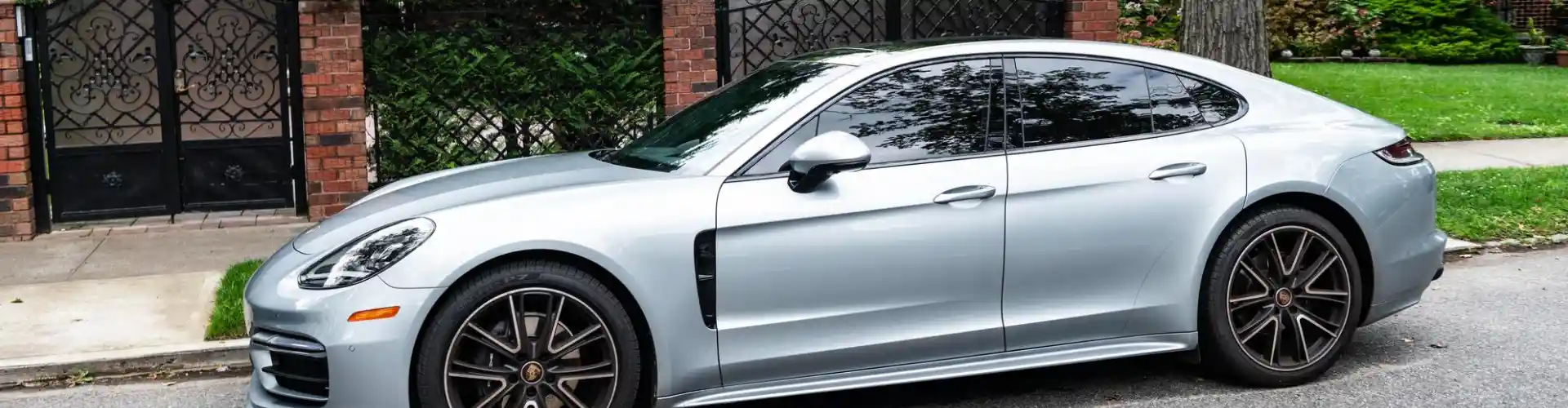 Armando King Mobile Detailing offers mobile car detailing for a silver car parked along the roadside.